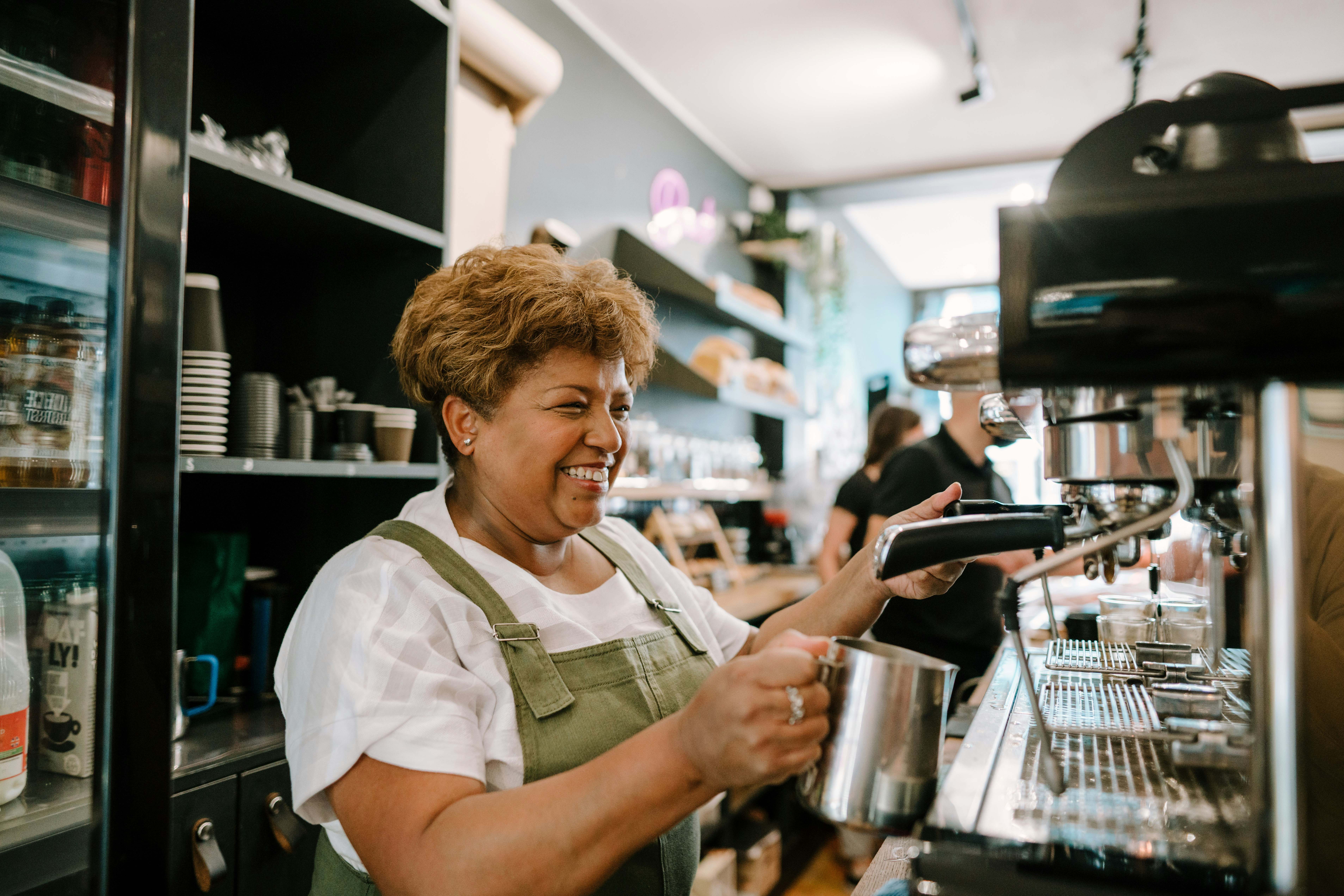 Local business owner happily at work